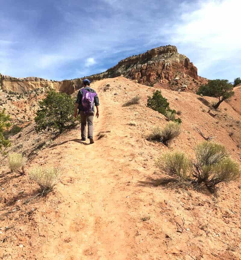 walking up a long desert trail
