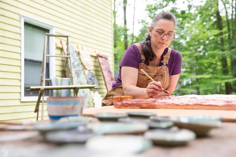 Val Gilman - artist and coach for artists, working on her art outside.