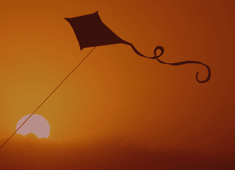 kite in a soft breeze at sunset.